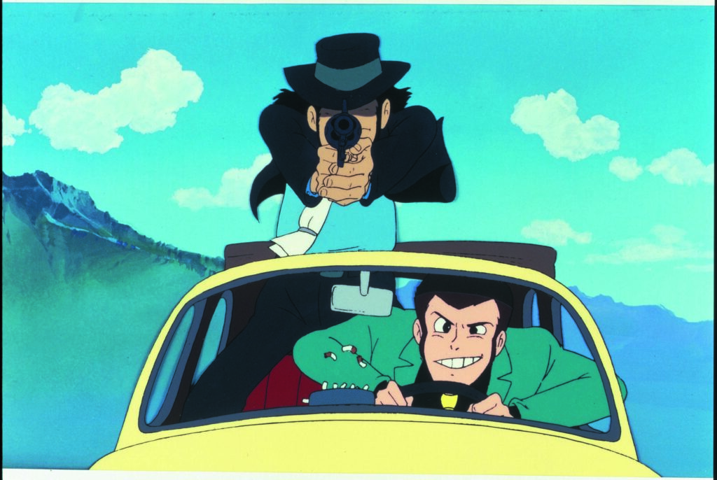 Lupin III e Jigen sulla fiat 500 gialla, una foto tratta dal film Lupin e il castello di Cagliostro