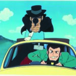 Lupin III e Jigen sulla fiat 500 gialla, una foto tratta dal film Lupin e il castello di Cagliostro